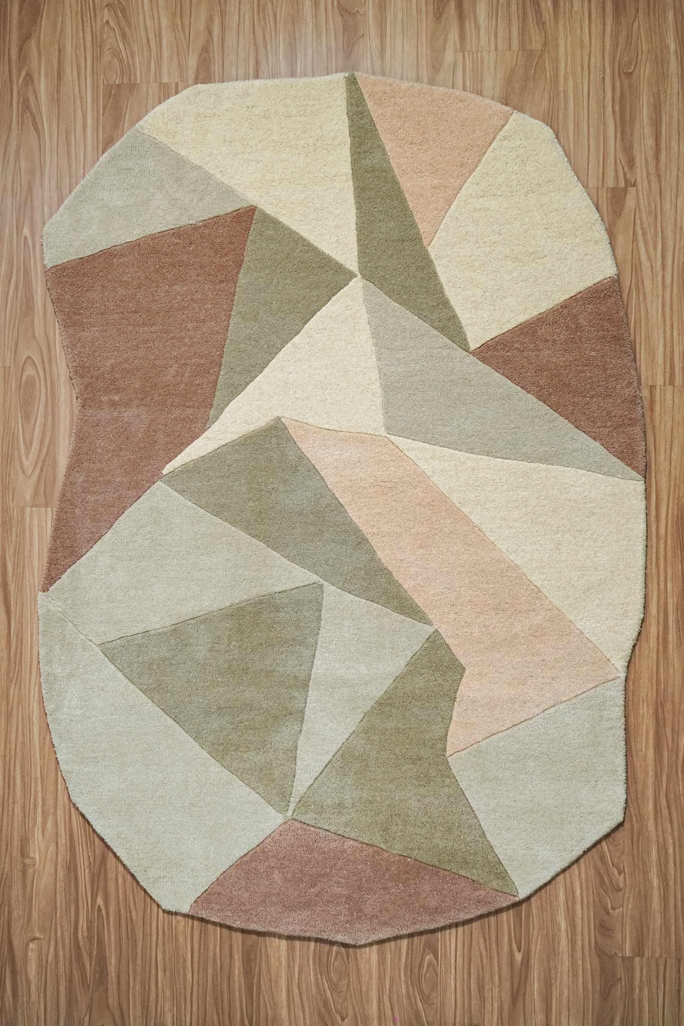 Hand-tufted geometric wool carpet with tribal diamond pattern in charcoal and ivory