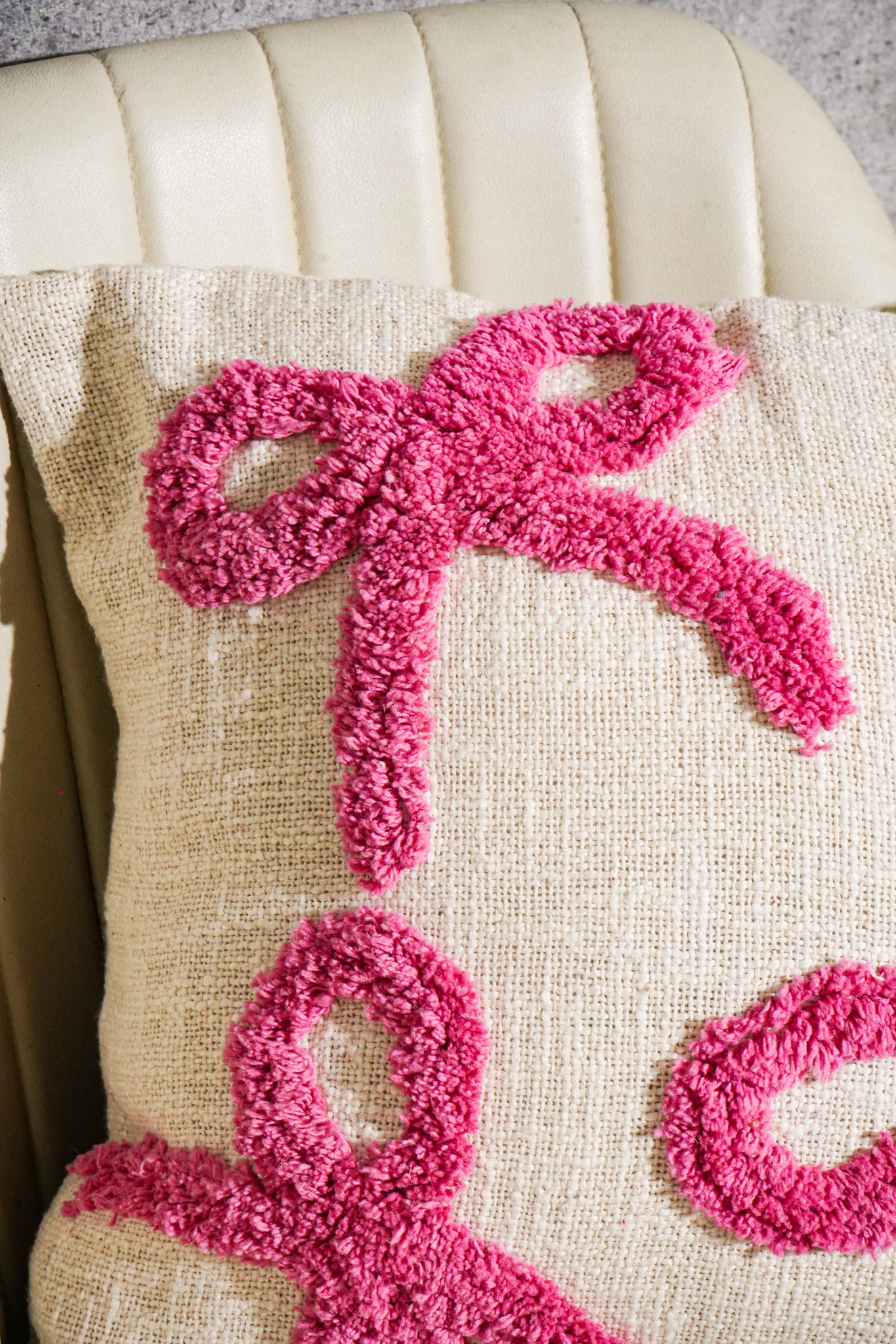 Hand-tufted cotton cushion cover detail showing tuft construction