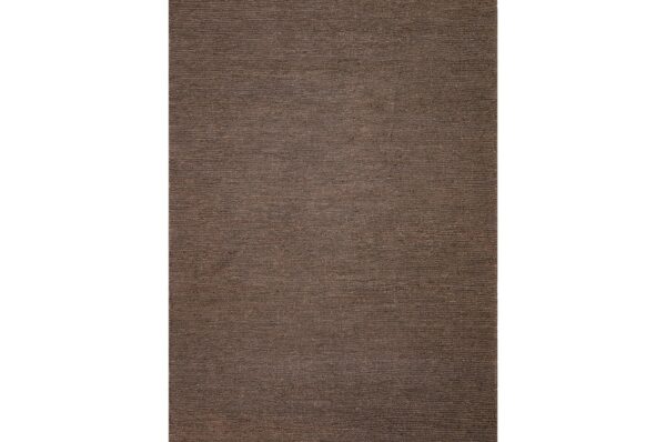 Handmade wool rug on loom during rug sourcing from India for wholesale buyers
