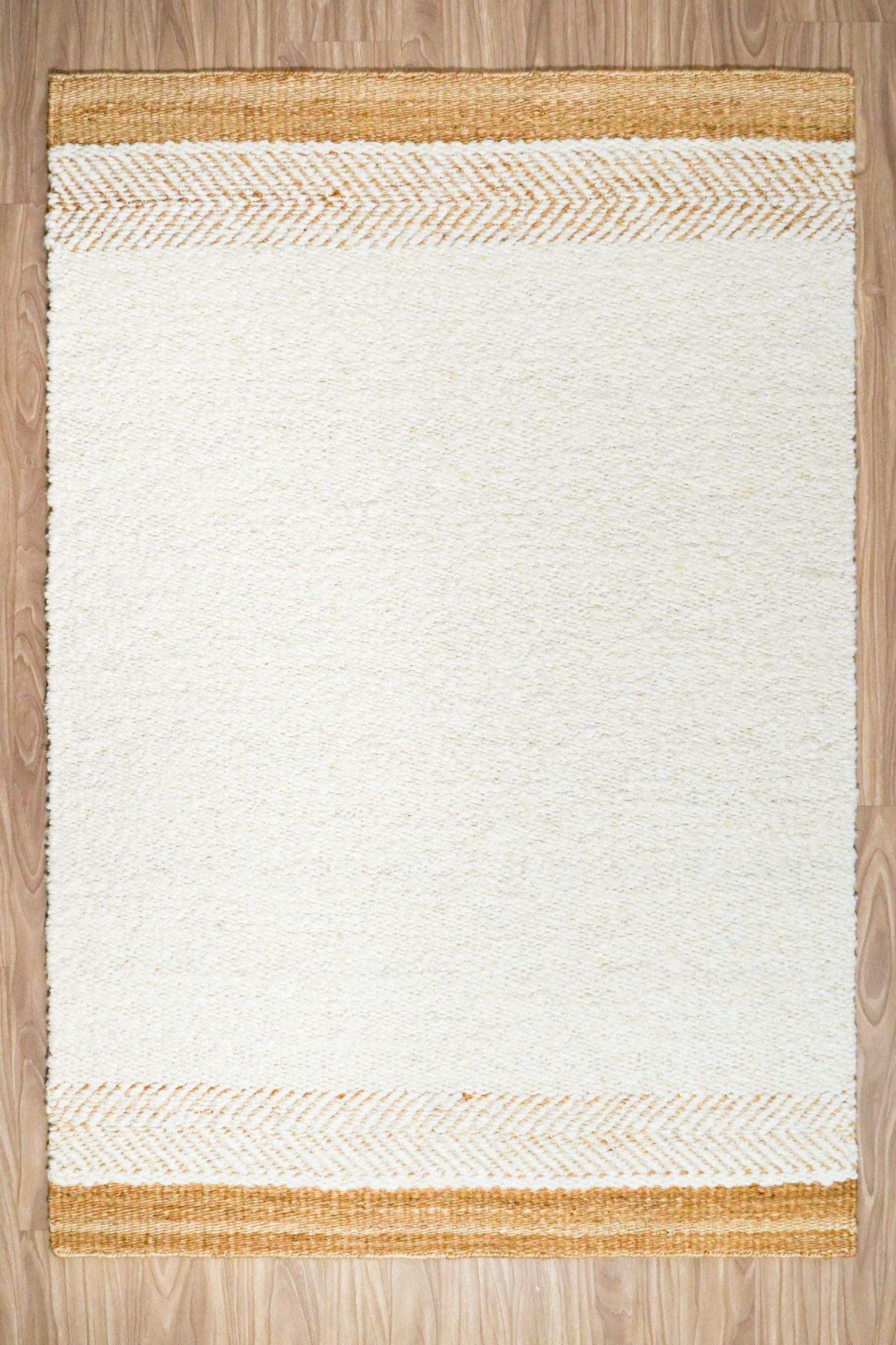 Handcarded wool rug AWD2603 IV in marled ivory tones, studio shot on white background