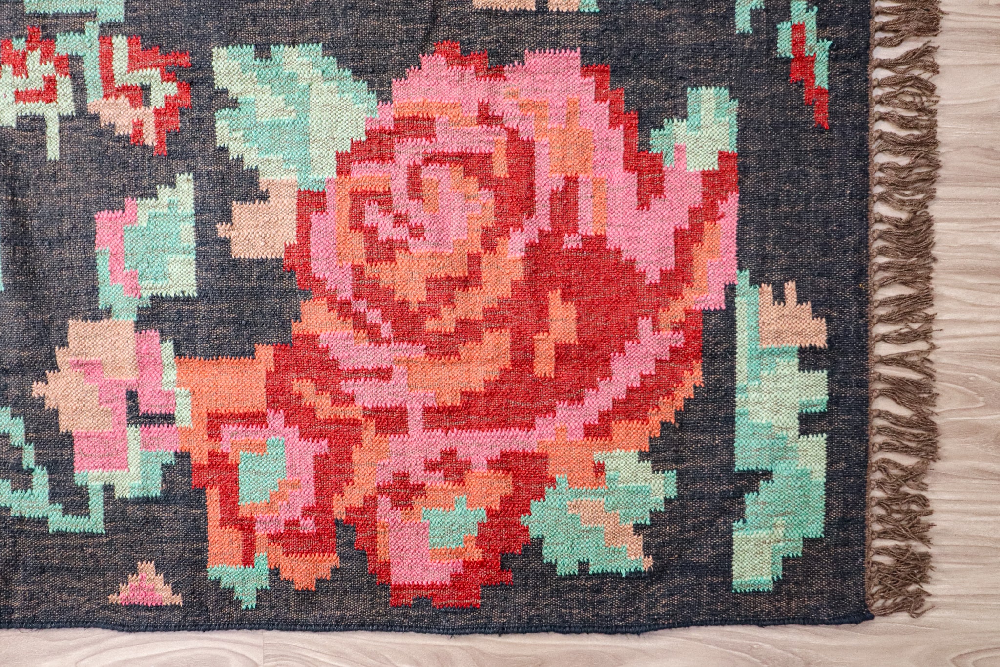 Chitara Rug Charcoal RU24-316 RD hand-braided jute rug styled in a room