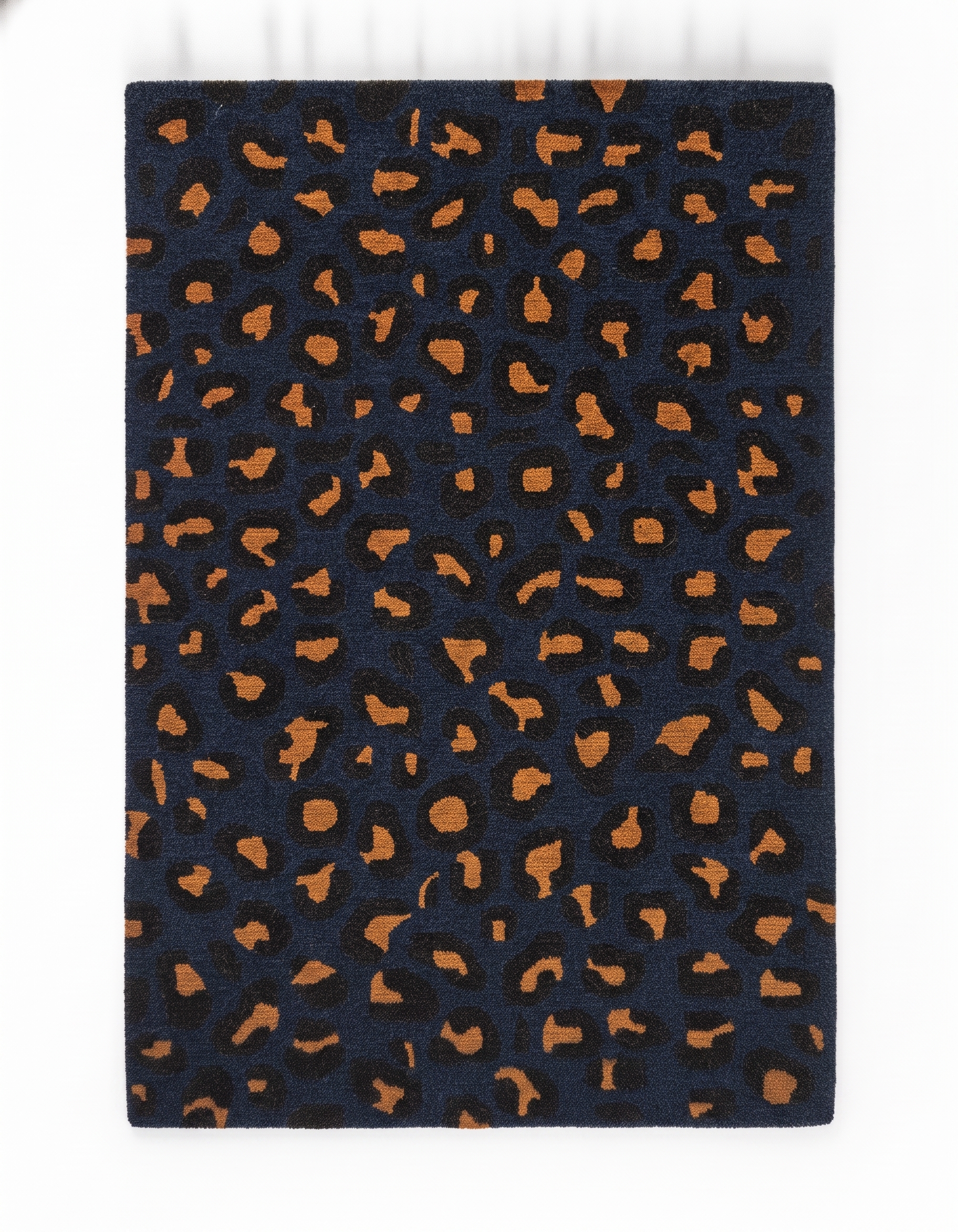 Close-up of hand-tufted wool weave and carved outline on Nocturnal Leopard Prowl carpet ATF-26047