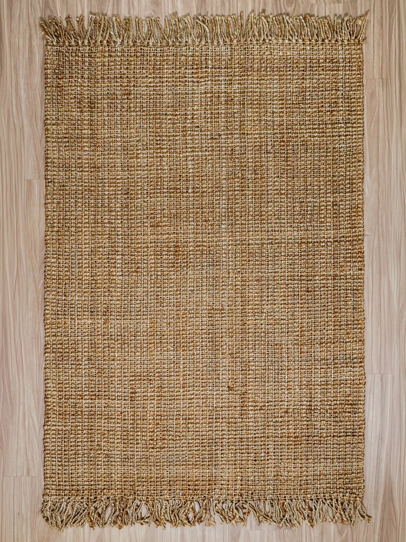 Stack of rectangular jute runners in stepped stripe patterns