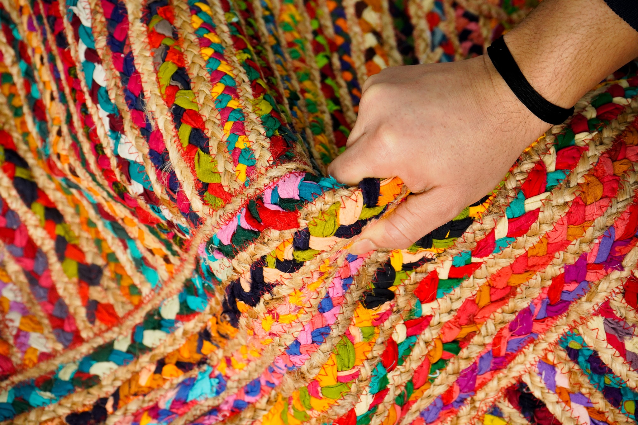 Close-up of hand-braided jute rug RU24-17 showing the coil and lockstitch weave