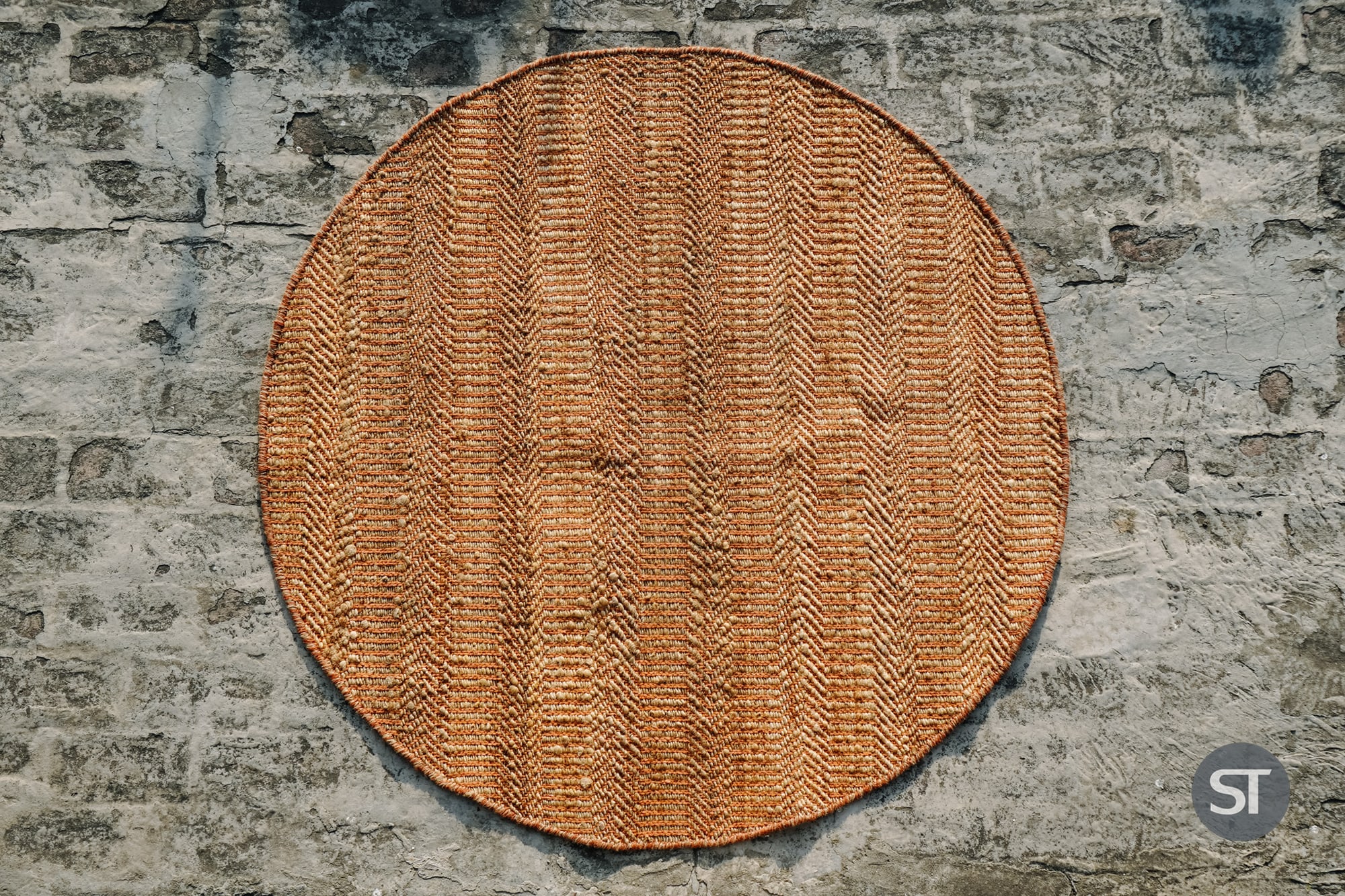 Round and oval jute rugs styled in a living room floor plan