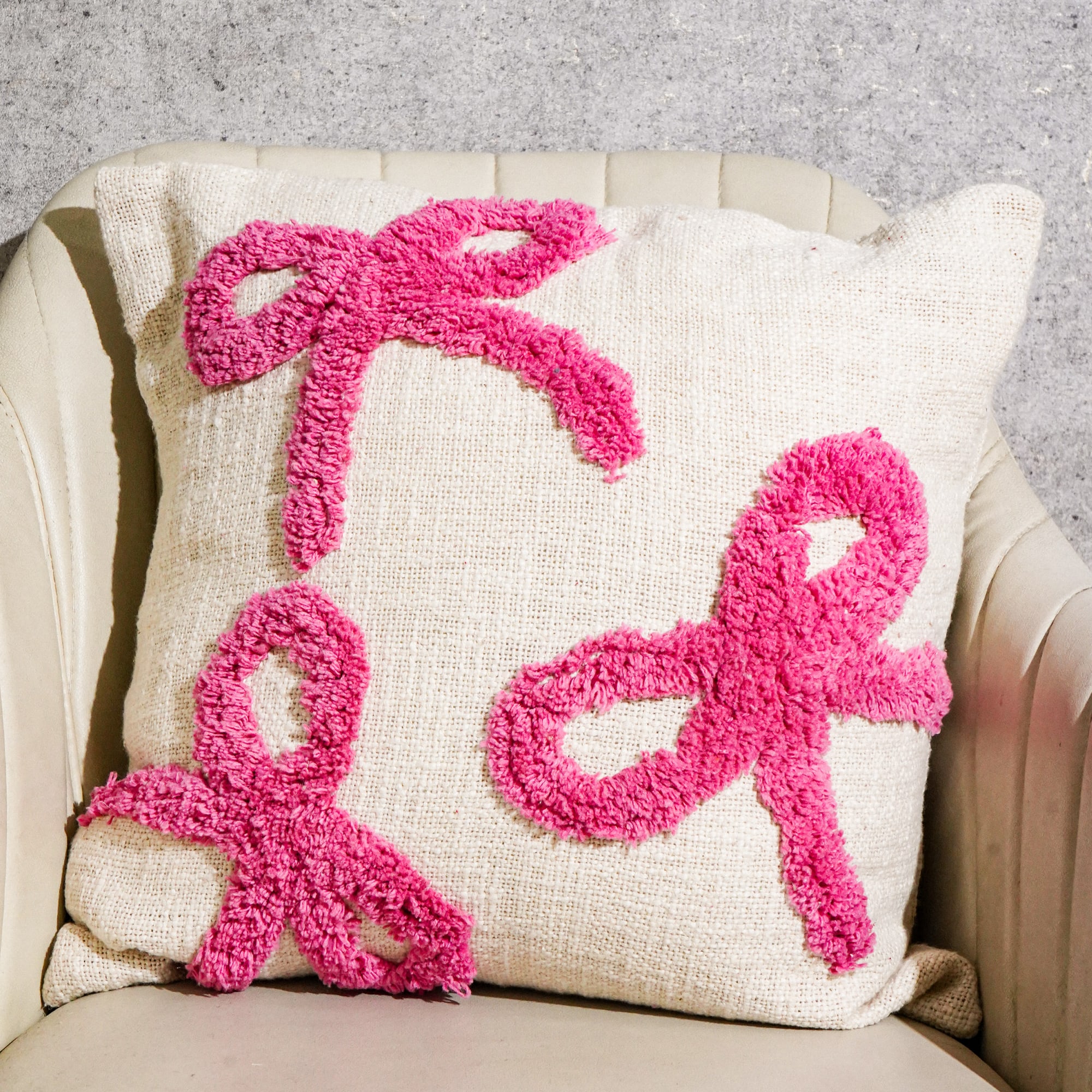 Cotton tufted cushion CC-2601 styled on a sofa setting