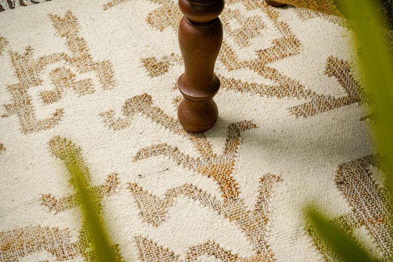 Patterned jute rug, styled detail with wooden furniture