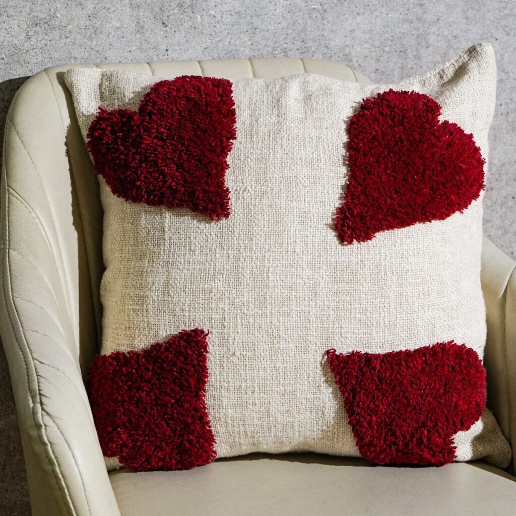Handmade cushion styled on a sofa, made in India for wholesale