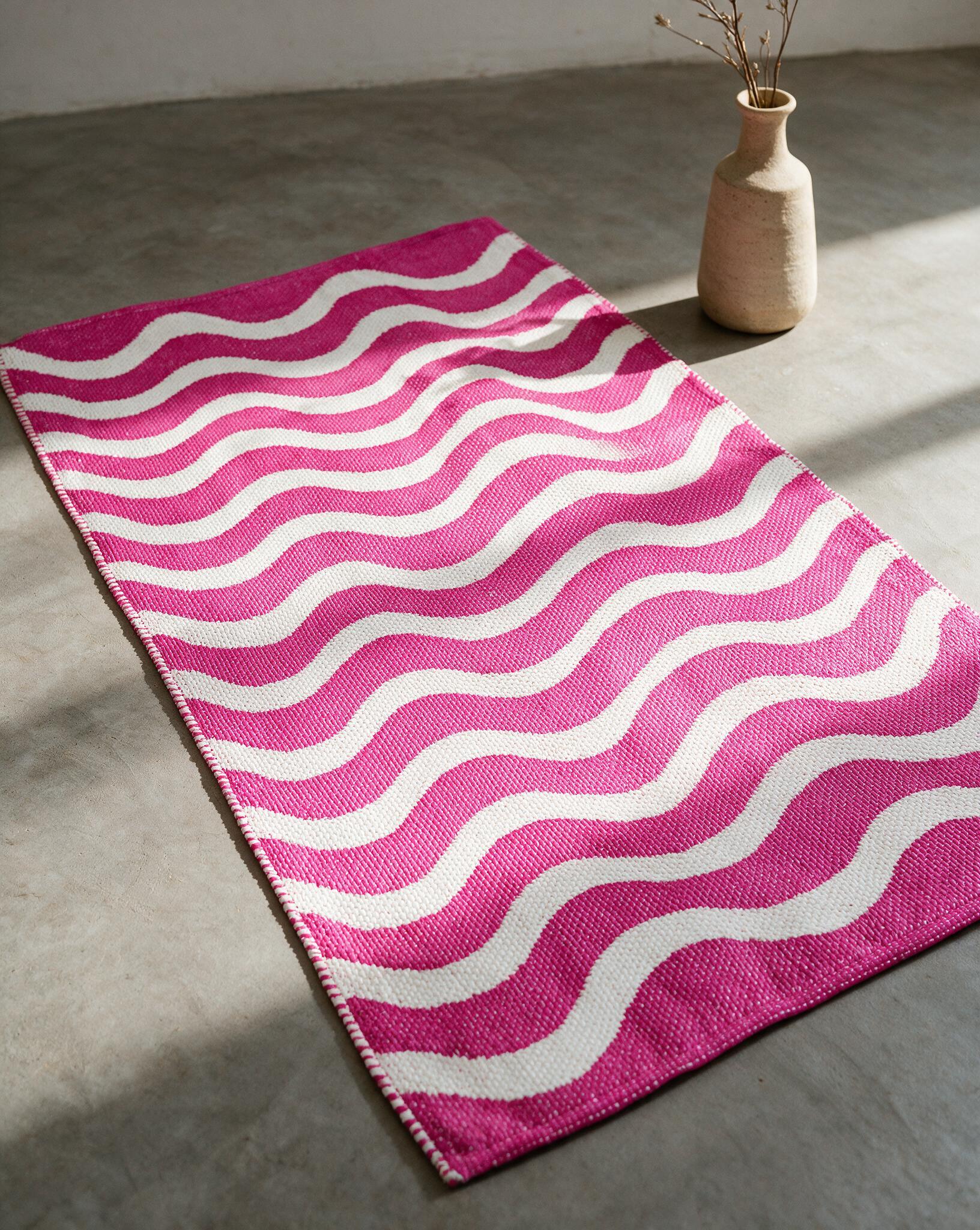 Wave Rug APD2610 PK pink colourway PVC jacquard rug styled in a room