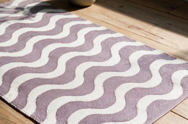 Wave Rug APD2610 handloom jacquard PVC rug styled in a modern living room