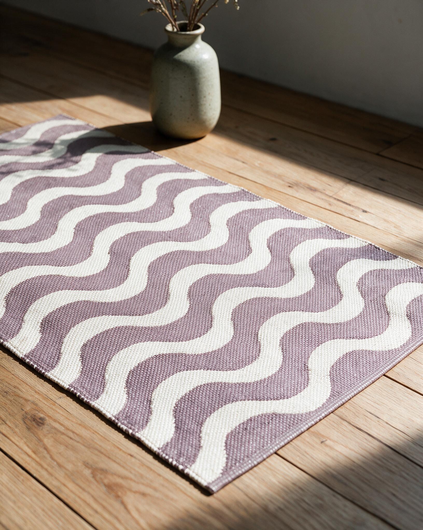 Wave Rug APD2610 handloom jacquard PVC rug styled in a modern living room