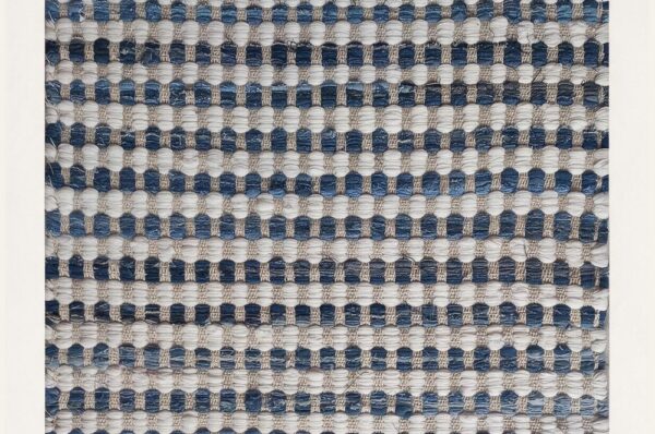 Illustrated cover: Wool vs Cotton vs Jute Rugs: A 2026 Retail Sourcing Guide. Sheeltex India product styled from the source photograph.