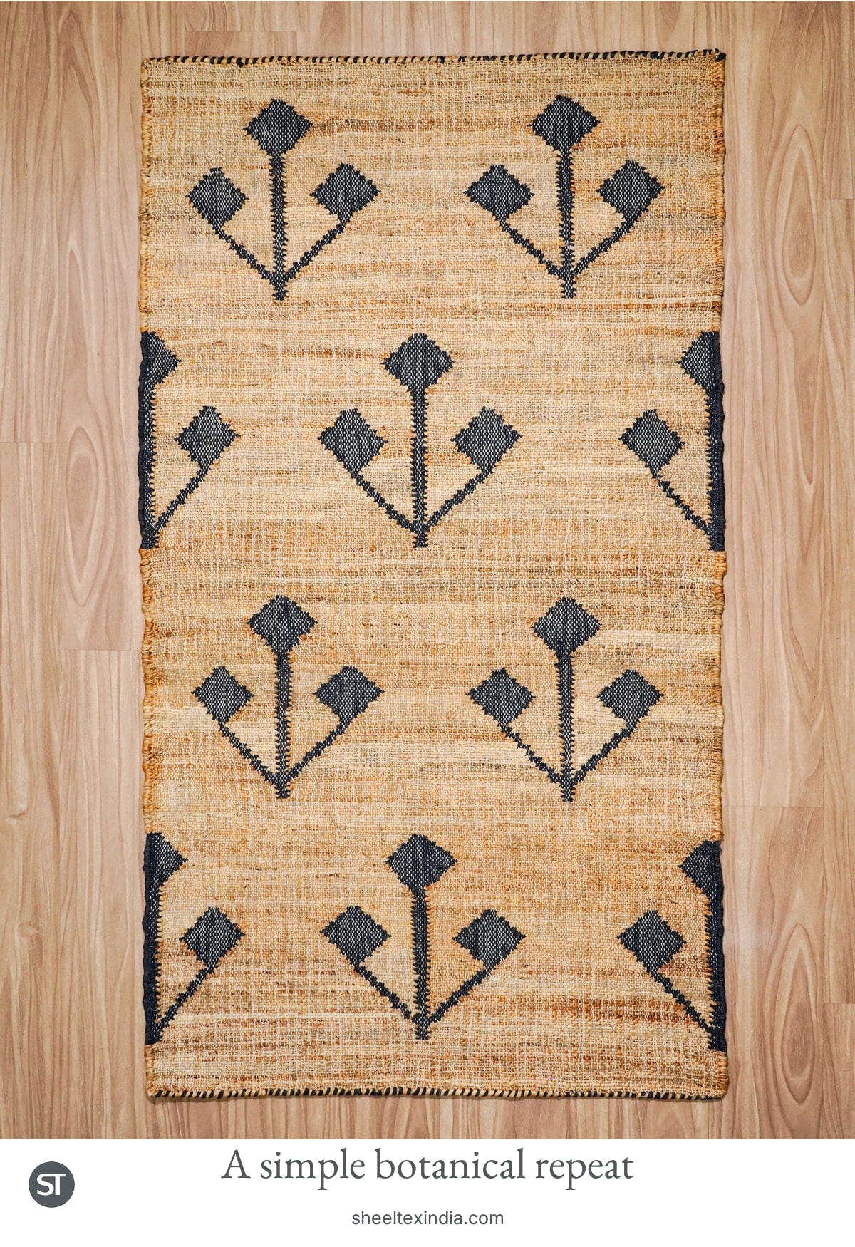 Complete rectangular natural-coloured rug with rows of dark three-stem motifs ending in diamond-shaped tips.