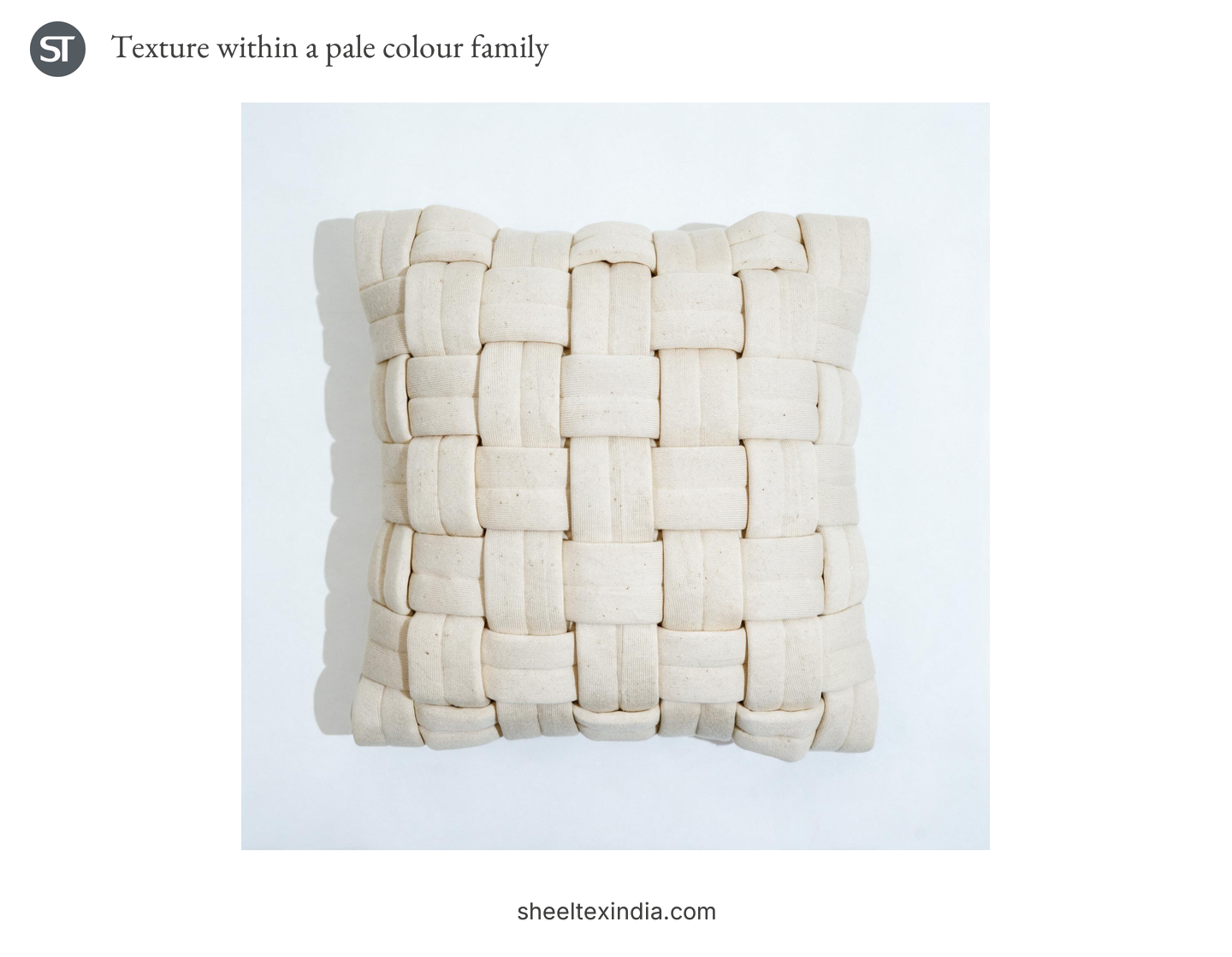 Ivory cushion cover with wide strips interlaced in a raised grid on a pale background.