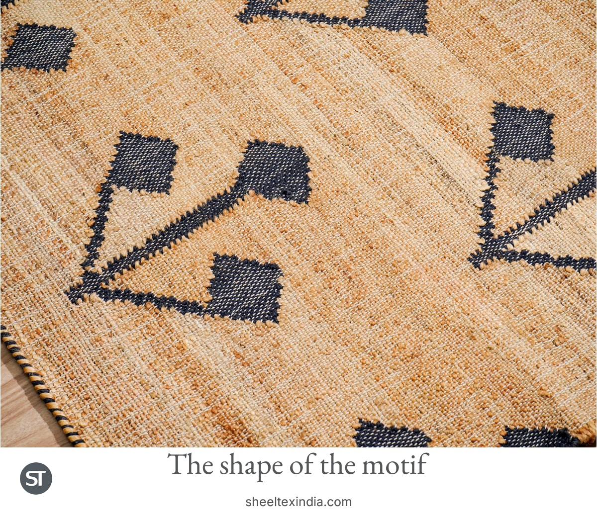 Close photograph shows the dark branching motif and diamond-shaped tips among cream and tan crossing threads.
